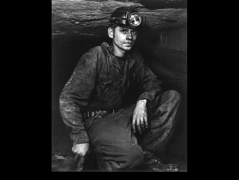 Kneeling Miner