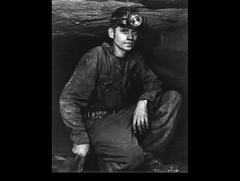 Kneeling Miner